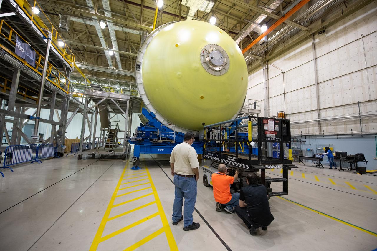 Employees wear personal protective gear at  Michoud Assembly Facility as the facility transitioned to Stage 3 of NASA’s Framework for Return To On-Site Work. Employees wear the appropriate personal protective equipment (PPE) and/or cloth face coverings as required for assigned tasks. Access to the facility is limited to authorized personnel working on mission-critical tasks that must be conducted onsite. Mission-critical tasks include slowly and methodically resuming Space Launch System (SLS) Core Stage and Orion production activities, particularly critical path deliverables to support the Artemis Program, at a pace that limits personnel and follows federal guidelines for social distancing and use of personal protective equipment such as face masks. For more information about SLS, visit nasa.gov/sls.